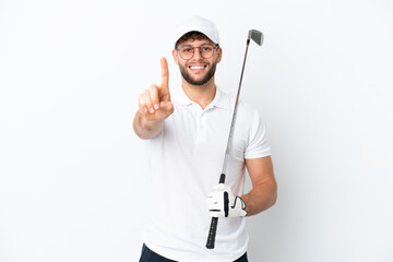 Handsome young man playing golf  isolated on white background showing and lifting a finger