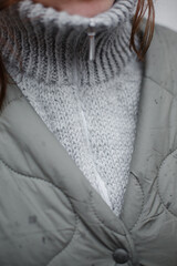 Homemade knitted alpaca collar. Warm wool sweater in natural wool