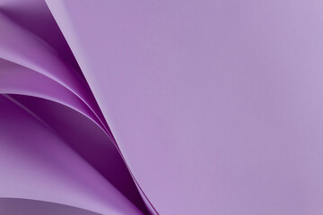 Abstract colored paper geometry composition monochrome background in purple color with curved lines and shapes