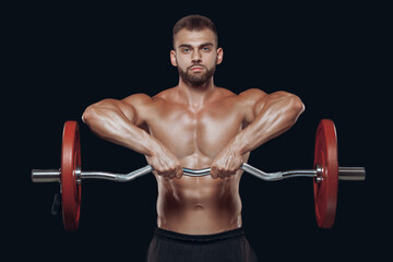 Fototapeta na wymiar Front view of a strong man bodybuilder lifting a barbell isolated on black background