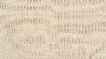 surface of unbleached cotton calico fabric closeup