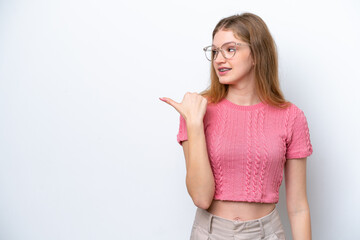 Teenager Russian girl isolated on white background pointing to the side to present a product