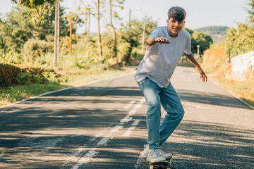 young teenager with skateboard skating on the street