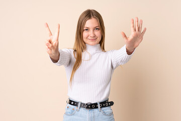 Teenager Ukrainian girl isolated on beige background counting eight with fingers