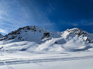 Fototapeta na wymiar Skitour on the sentisch horn. Mountaineering in a wonderful mountain world in davos switzerland. snowy mountain peaks