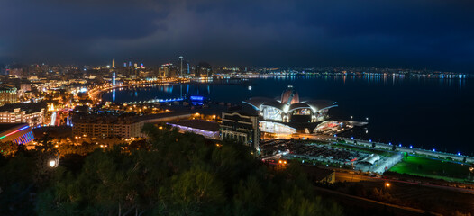 Baku, Azerbaijan - January 03 2022- Panoramic city view with Caspian Sea at night.
