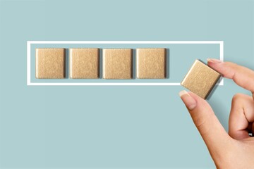 Female hand putting wooden cube for the countdown to 2022. Loading year from 2021 to 2022.