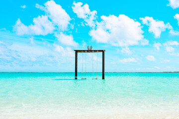 picturesque landscape in the Maldives with swings in the water