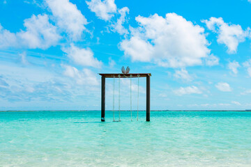 picturesque landscape in the Maldives with swings in the water