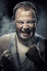 Brutal angry man covered by the dust