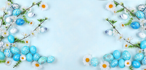 Festive easter banner,spring composition with decorated homemade eggs and flowering...