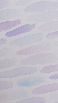 Background with small ink blots made with watercolor in blue, purple and pink colors on textured paper