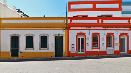 White and yellow-red-blue painted Neoclassical townhouses-Rua Porta Nova Street. Tavira-Portugal-095 - obrazy, fototapety, plakaty