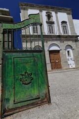 Rusty iron green gate open-Living Science Center-Ciencia Viva-gravel courtyard. Tavira-Portugal-103 - obrazy, fototapety, plakaty