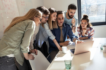 Software developing workers at a meeting  in conference room. They discuss future projects.	
