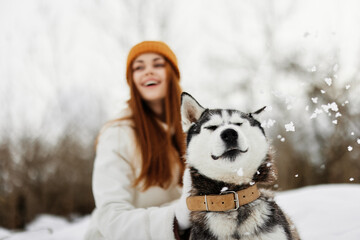 woman with dog winter walk outdoors friendship winter holidays