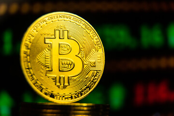 Golden bitcoin with rising green stock trading chart. Crypto currency future of world economy