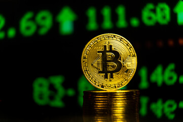 Pile of bitcoins with rising stock trading chart. Crypto currency growth in world e-commerce banking system financial concept