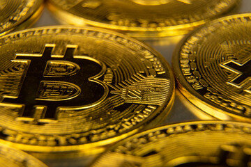 Golden coins layout macro shot. Bitcoin BTC virtual money produced by blockchain technology