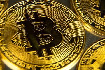 Golden bitcoin close up macro shot. Crypto currency growth in world e-commerce system financial concept