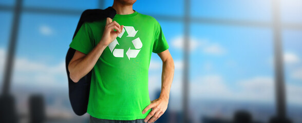 Environmental business man opens his shirt to show recycle mark in modern office. Protect and save Earth Planet Blurred skye. Concept of environmental.