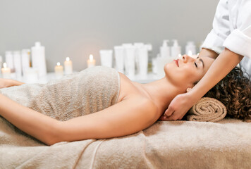 Obraz na płótnie Canvas Woman enjoying massage in spa salon