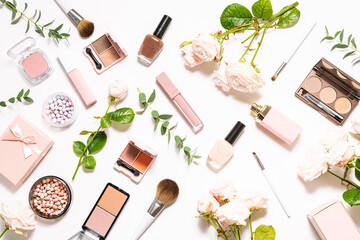 Bright spring composition with assortment of decorative cosmetic products on white background with aromatic roses and eucalyptus leaves top view. Spring cosmetic sale and promo banner. - obrazy, fototapety, plakaty