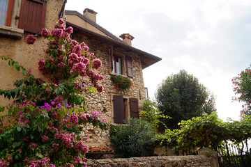 old romantic and picturesque houses of Italian town of Malcesine on lake Garda on a fine October day (Italy, Lombardy) 