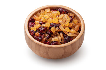 Organic dried raisins and cranberries in wooden bowl isolated on white background