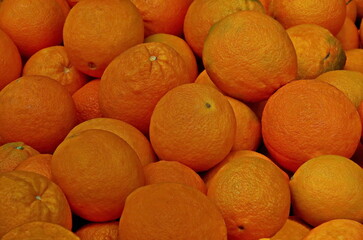 Background from a pile of fresh, ripe orange fruits, Sofia, Bulgaria 