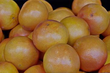 Background from a pile of fresh, ripe grapefruit fruits, Sofia, Bulgaria 