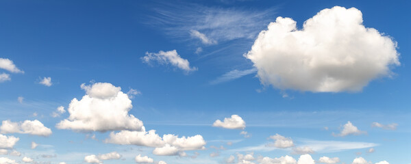Natural beautiful abstract scenic azure blue sky with white cumulus clouds background on bright sunny summer day. Nature cloudscape tranquil landscape scene backdrop pattern