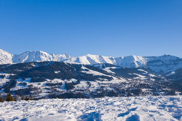 Fototapeta na wymiar The city of Megeve in the middle of the Mont Blanc massif in Europe, France, Rhone Alpes, Savoie, Alps, in winter, on a sunny day.