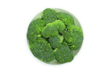 Fresh green broccoli cabbage pieces in a bowl isolated on white background, top view.