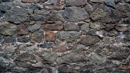 Stone wall texture background. Different size stone wall of old castle 