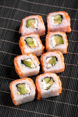 Sushi Rolls Philadelphia with salmon, avocado, soft cheese