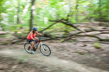 Fototapeta premium woman mountain biking