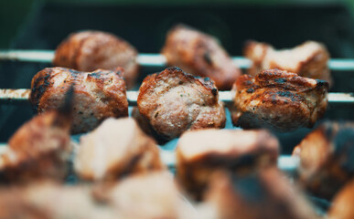 Tasty pork shashlik on the grill.