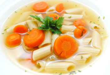 Vegan Penne Vegetable Soup Served in a White Bowl	