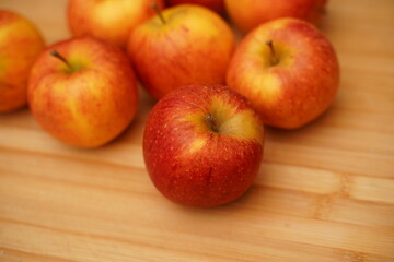 red apples on wooden table