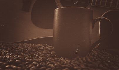Acoustic Guitar, black coffee cup and roasted coffee beans spread on the table, matte and vintage