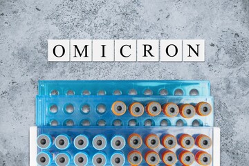 New COVID variant Omicron concept with syringe