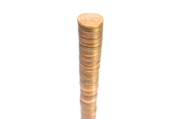 Stack of 5 euro cent coins. High stack of 5 cents coins on white background.