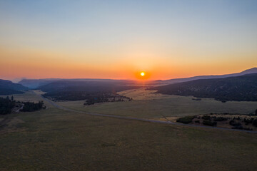 Fototapeta premium Aerial sunset view with mountains