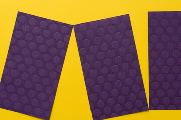 purple paper rectangles on yellow