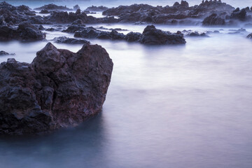 Obraz premium Water with rock nature photo with long exposure fog effect.abstract color ocean background
