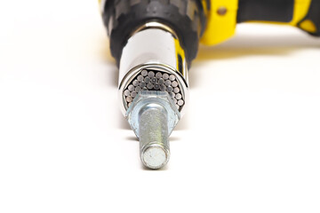 Cordless screwdriver, bolt. Universal socket wrench and adapter on an isolated white background.