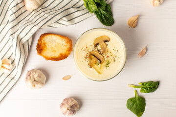 garlic soup puree on a white table