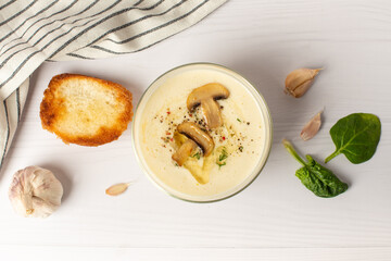 garlic soup puree on a white table