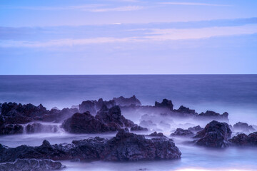 Obraz premium Water with rock nature photo with long exposure fog effect abstract color ocean background 